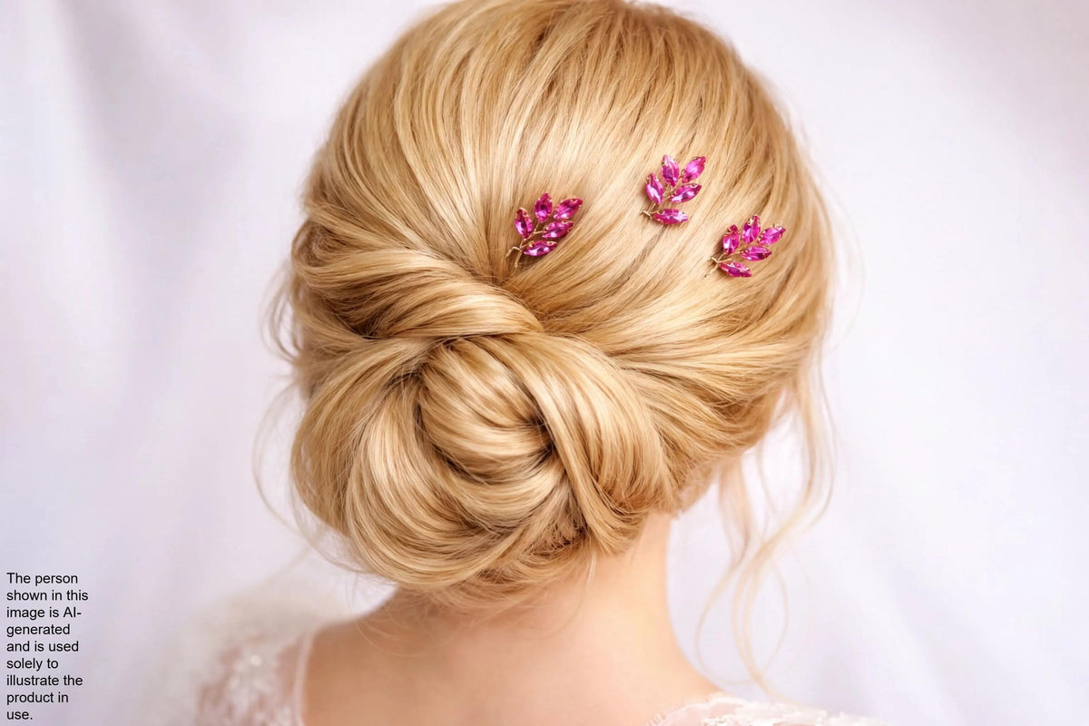 the back view of a woman's blonde hair with three small, pink flower-like accessories attached to the hair.
