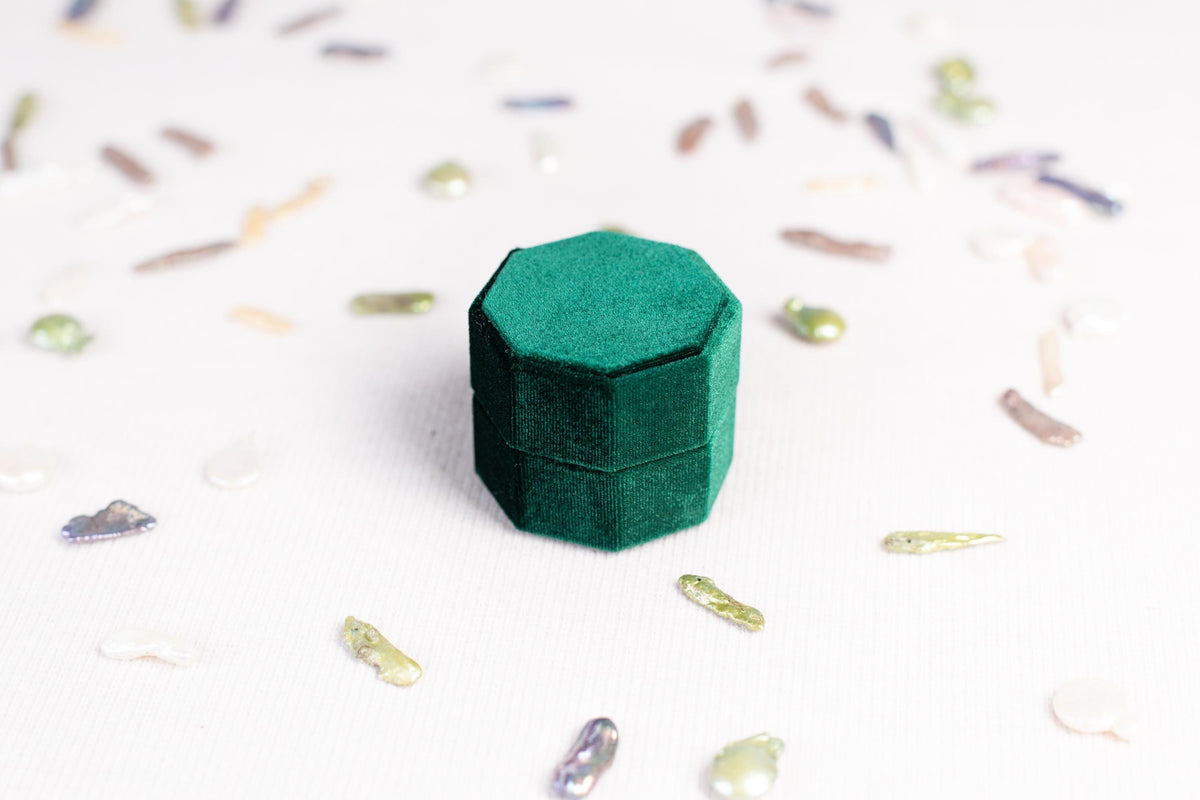 a small green box sitting on top of a table