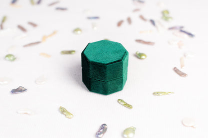a small green box sitting on top of a table