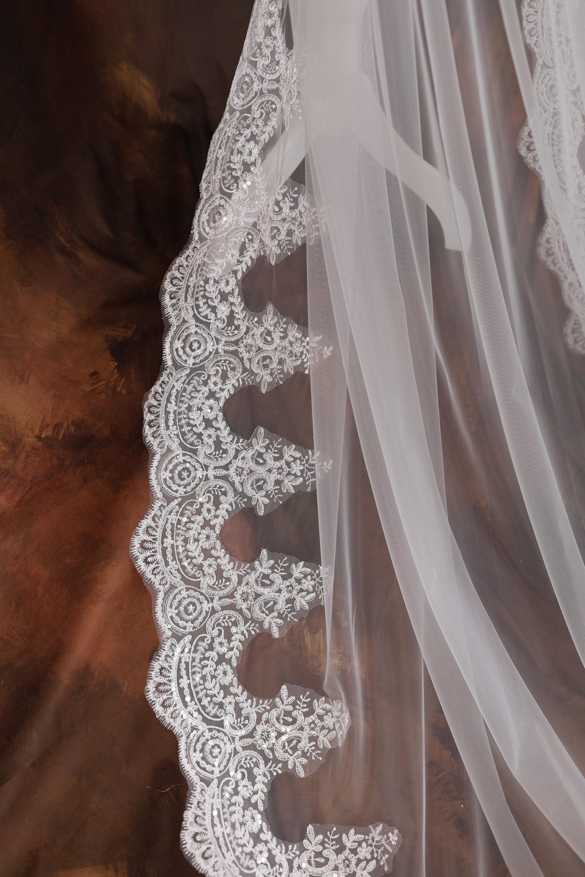 a close up of a wedding veil on a table