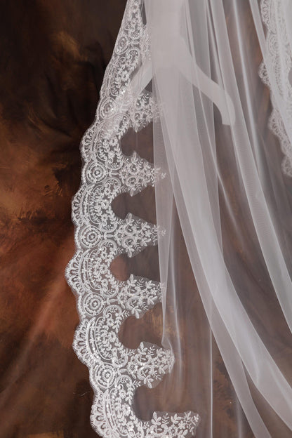 a close up of a wedding veil on a table