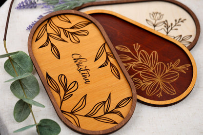 a close up of three wooden plaques on a table