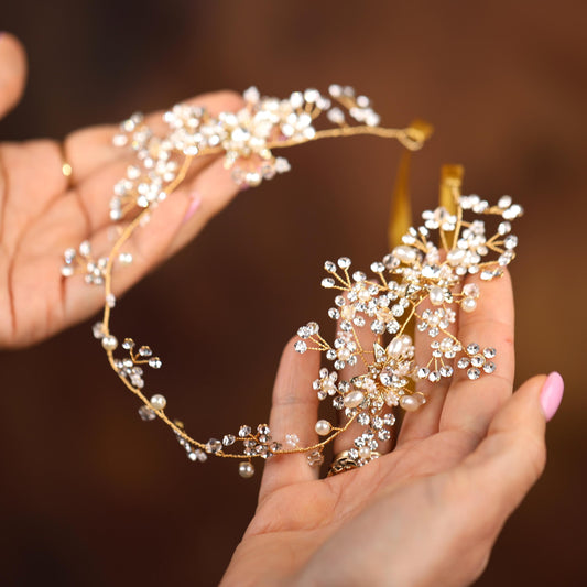 a close up of a person holding a piece of jewelry