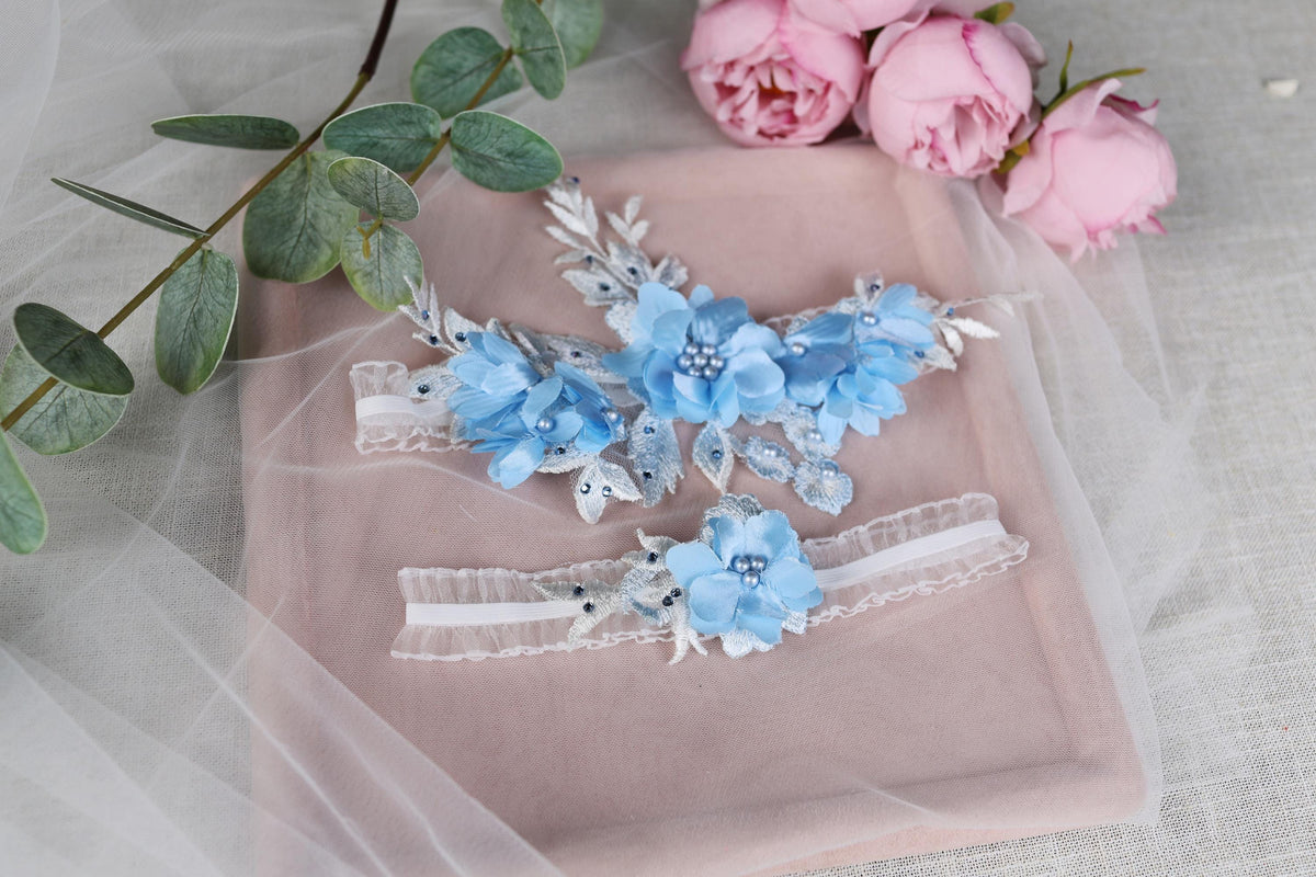 a couple of blue flowers sitting on top of a pink tray