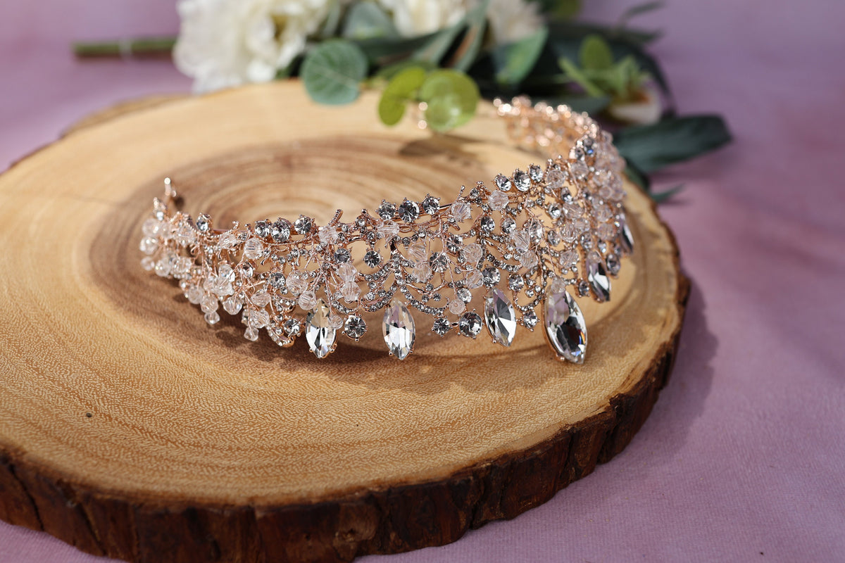 a tiara sitting on top of a wooden piece of wood