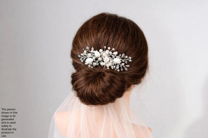 A close-up view of a woman's hair with a decorative hair accessory, such as a flower or crystal piece, pinned to the back of her head.