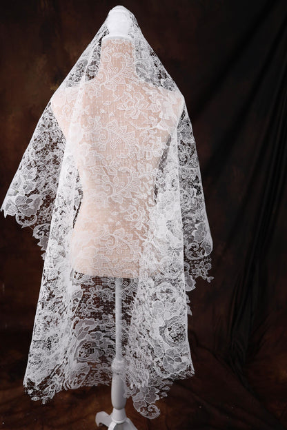 a wedding veil on a mannequin on a black background