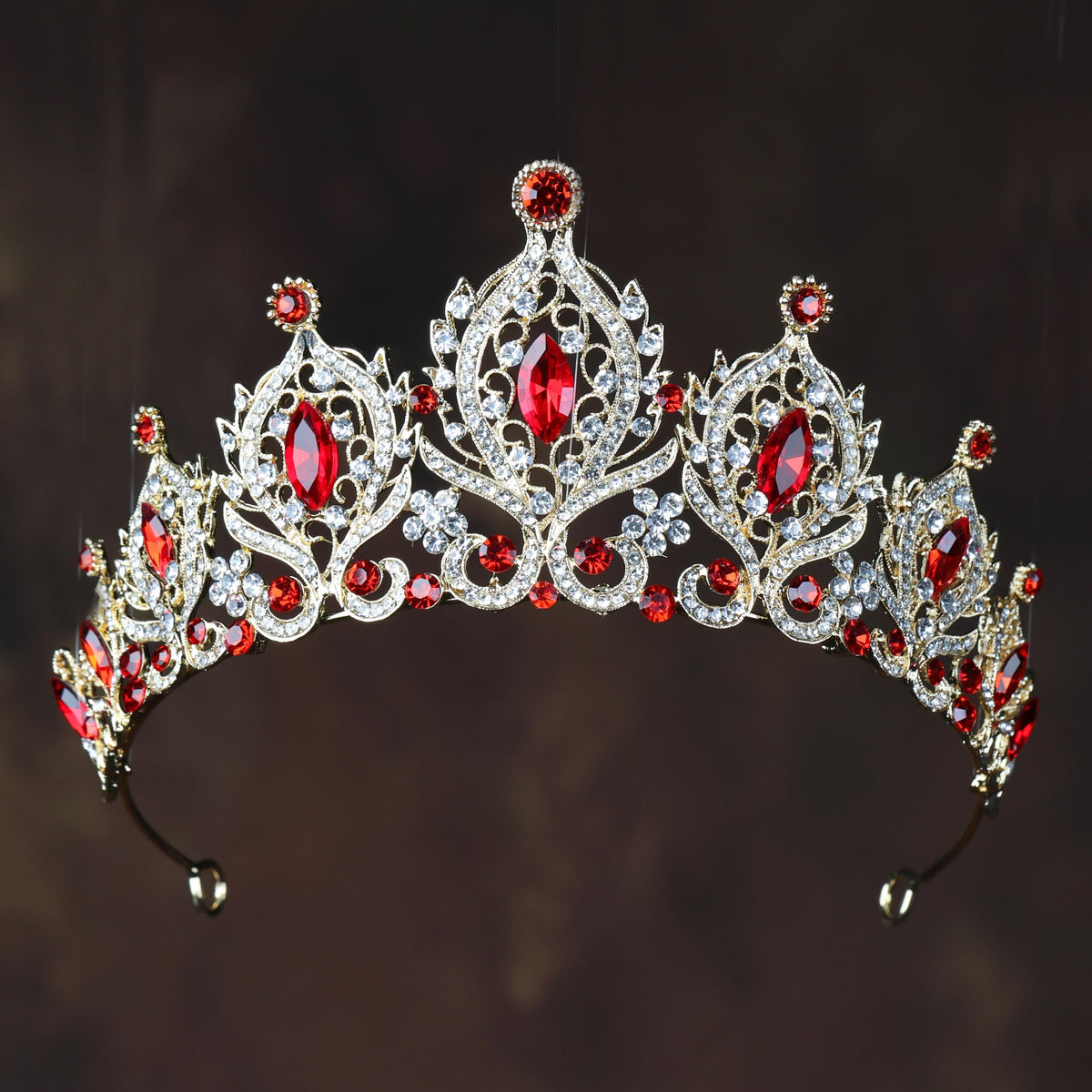 a tiara with red and white stones on it