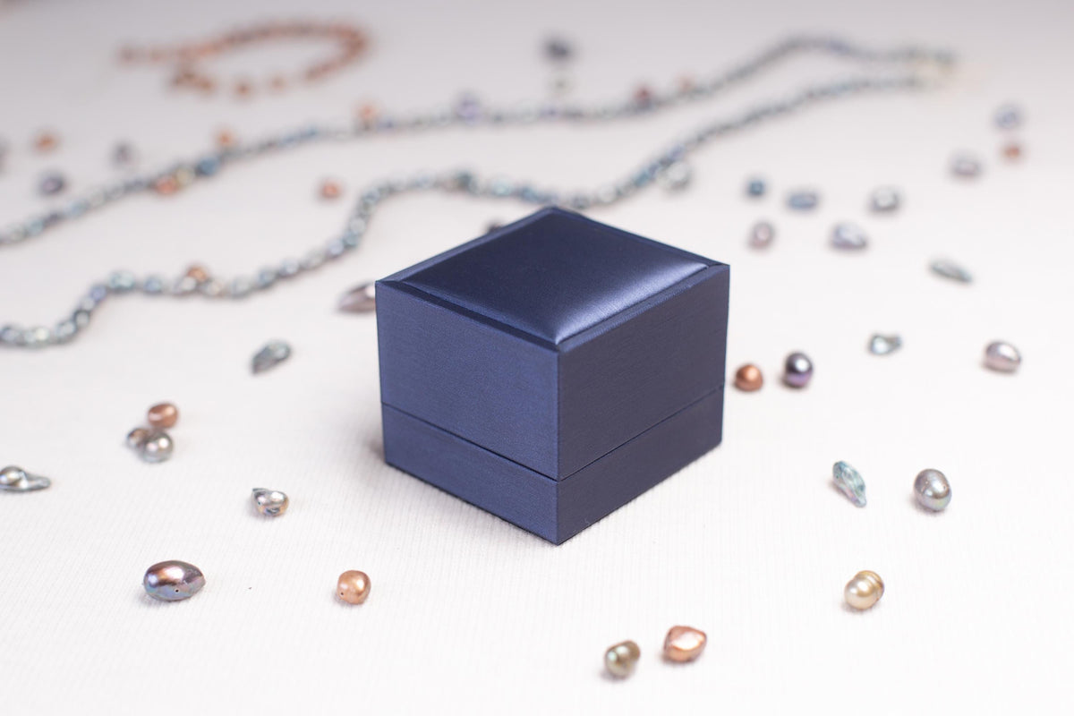 a small blue box sitting on top of a table