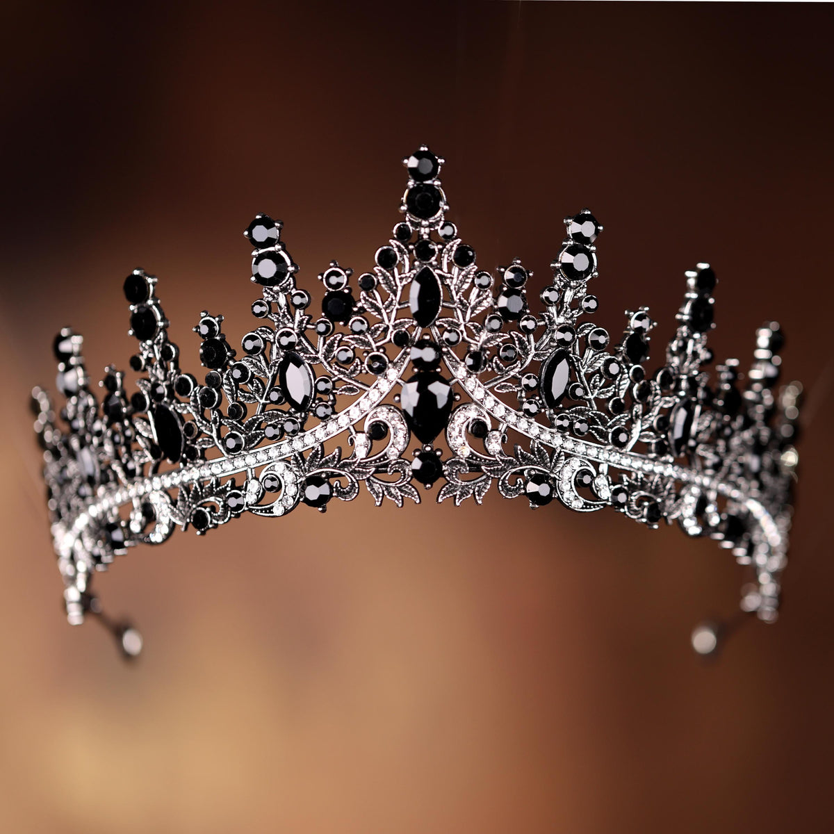 a black and white tiara on a brown background