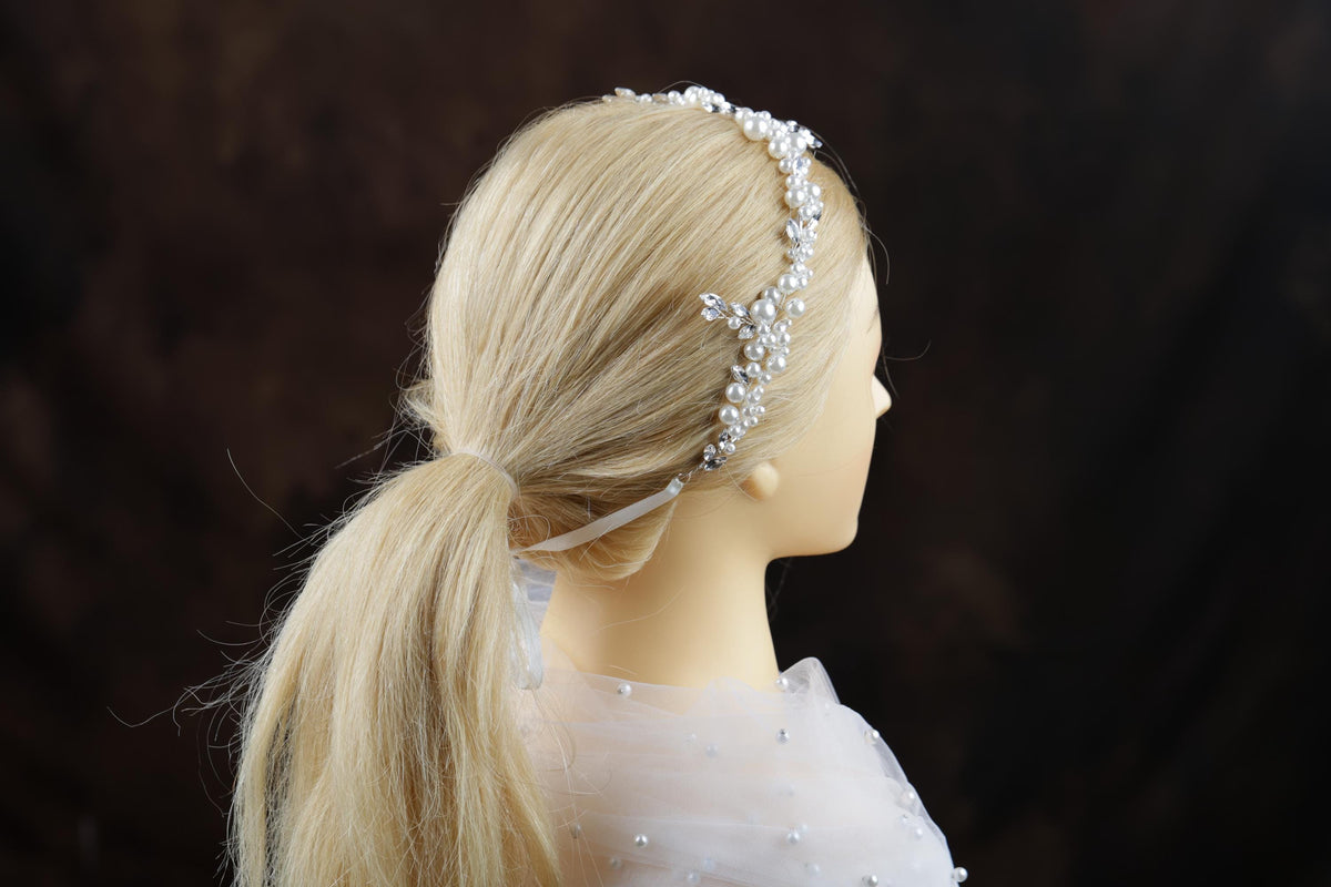 a blonde wig with a headband on top of it