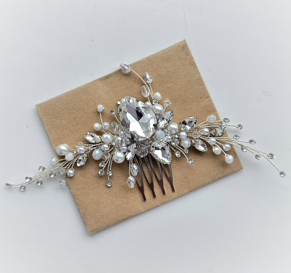 a bridal hair comb with crystal and pearls