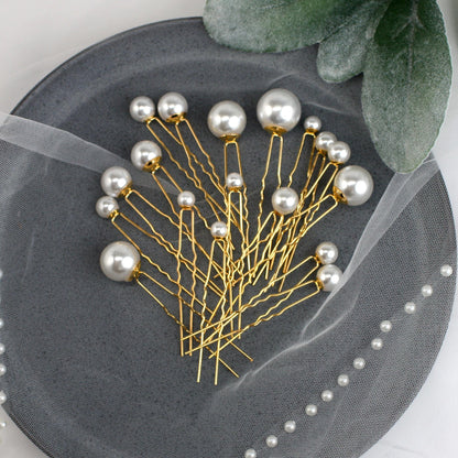 a bunch of pins sitting on top of a plate