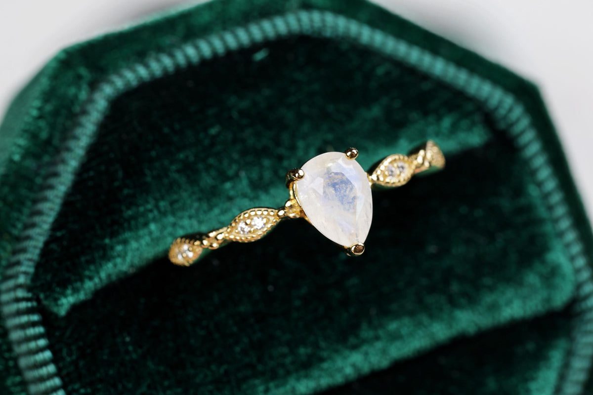 a close up of a ring in a velvet case