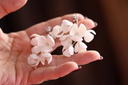 a person holding a bunch of flowers in their hand