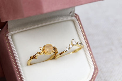 a couple of rings sitting inside of a box