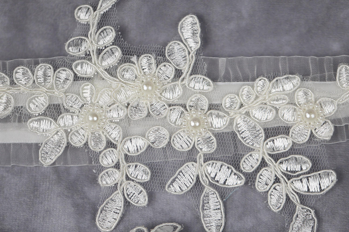 a close up of a piece of cloth with flowers on it