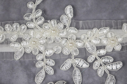 a close up of a piece of cloth with flowers on it