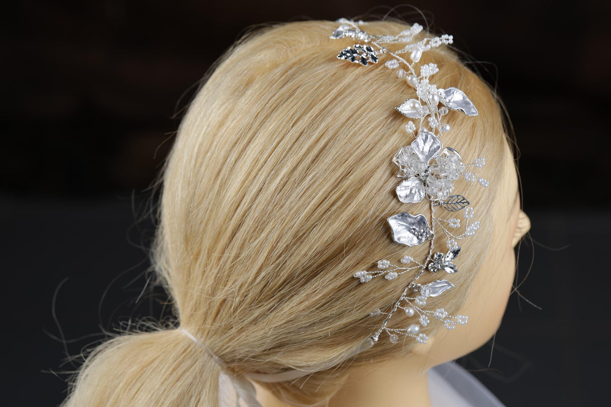 a woman wearing a bridal hair piece