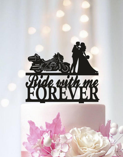a wedding cake with a bride and groom on top