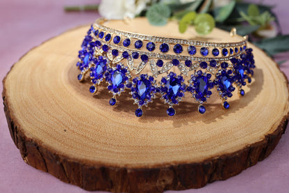 a close up of a tiara on a piece of wood