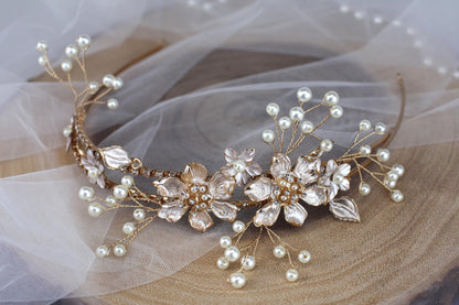 a close up of a tiara with pearls