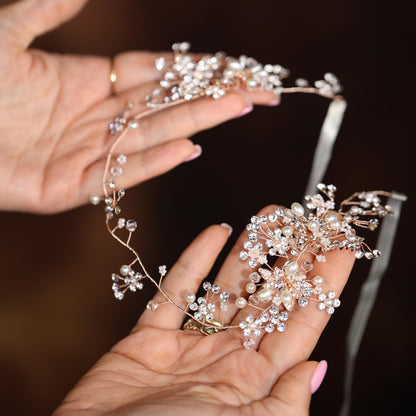 a woman is holding a tiara in her hands