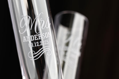 a couple of glass vases sitting on top of a table