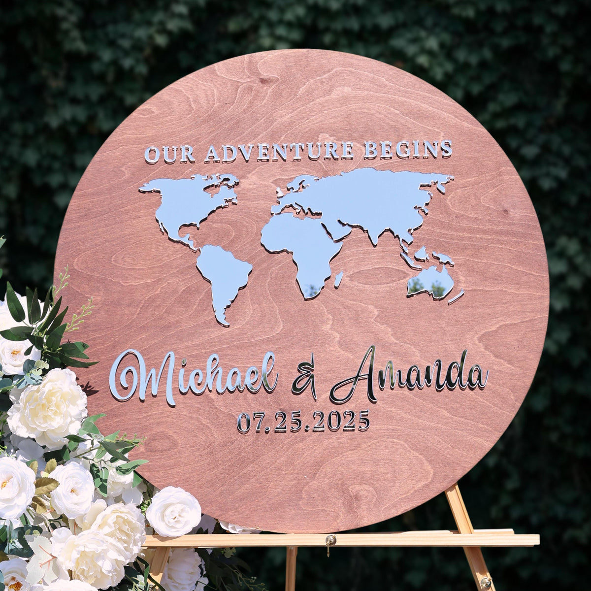 a wooden sign with a world map and the names "Michael & Amanda" written on it.