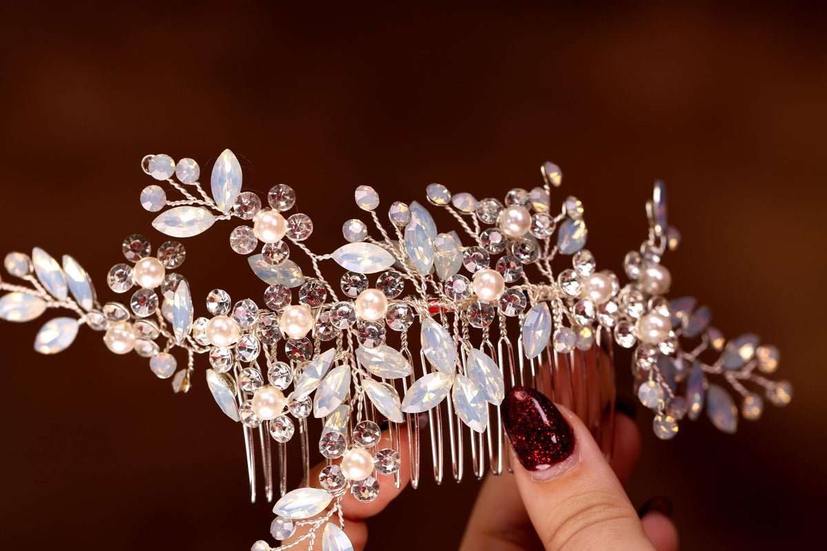 a close up of a person holding a hair comb