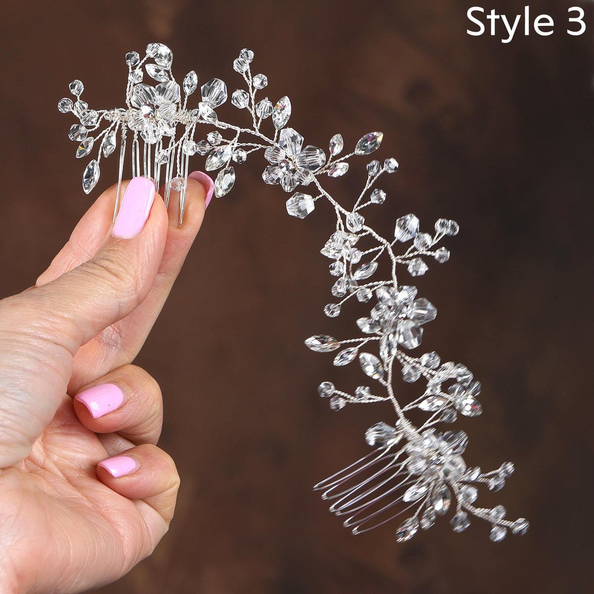 a woman's hand holding a hair comb with a flower design on it