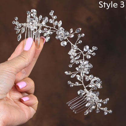 a woman's hand holding a hair comb with a flower design on it