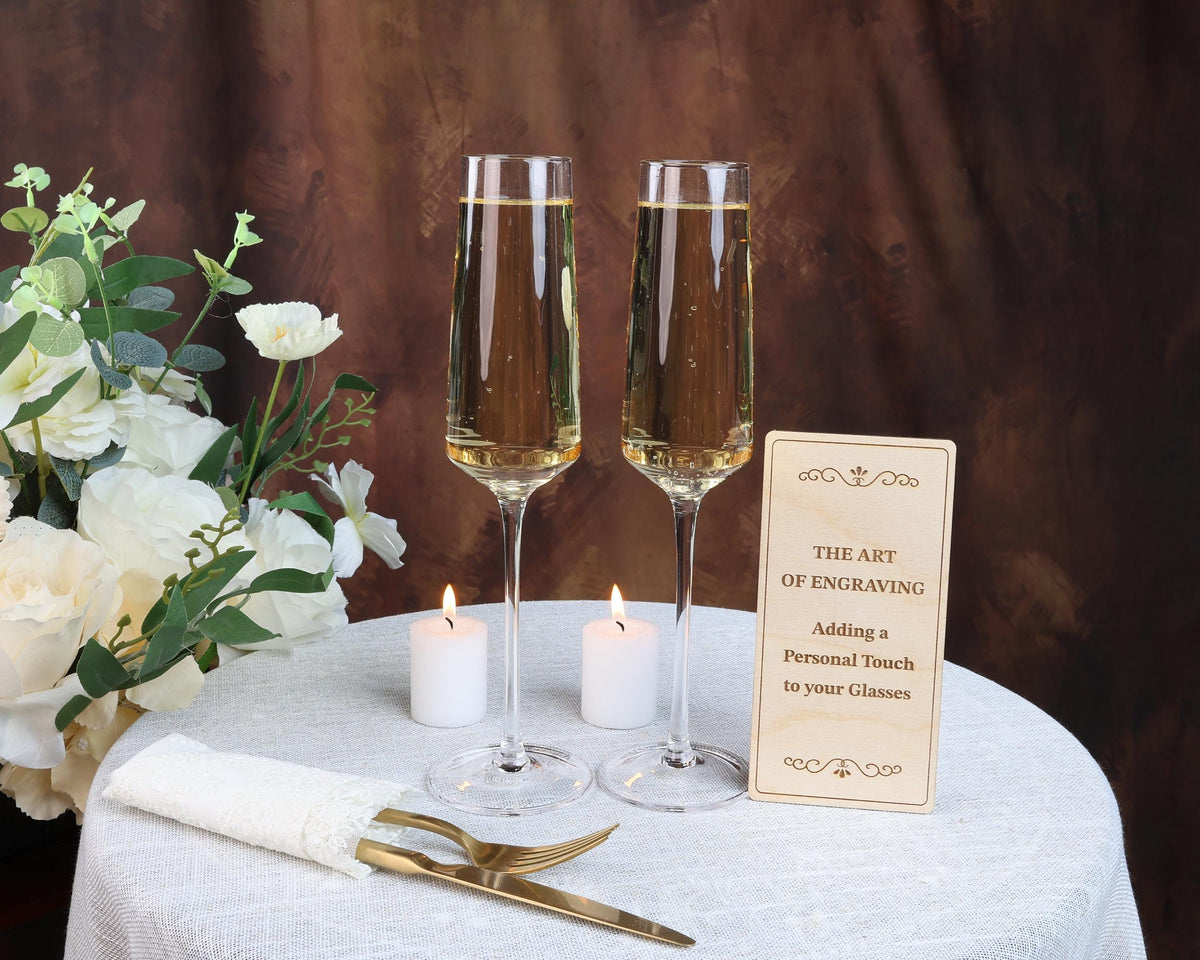 a table topped with two glasses of wine