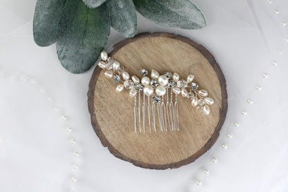a close up of a hair comb with pearls