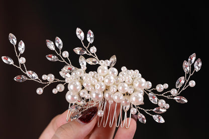 a close up of a person holding a hair comb