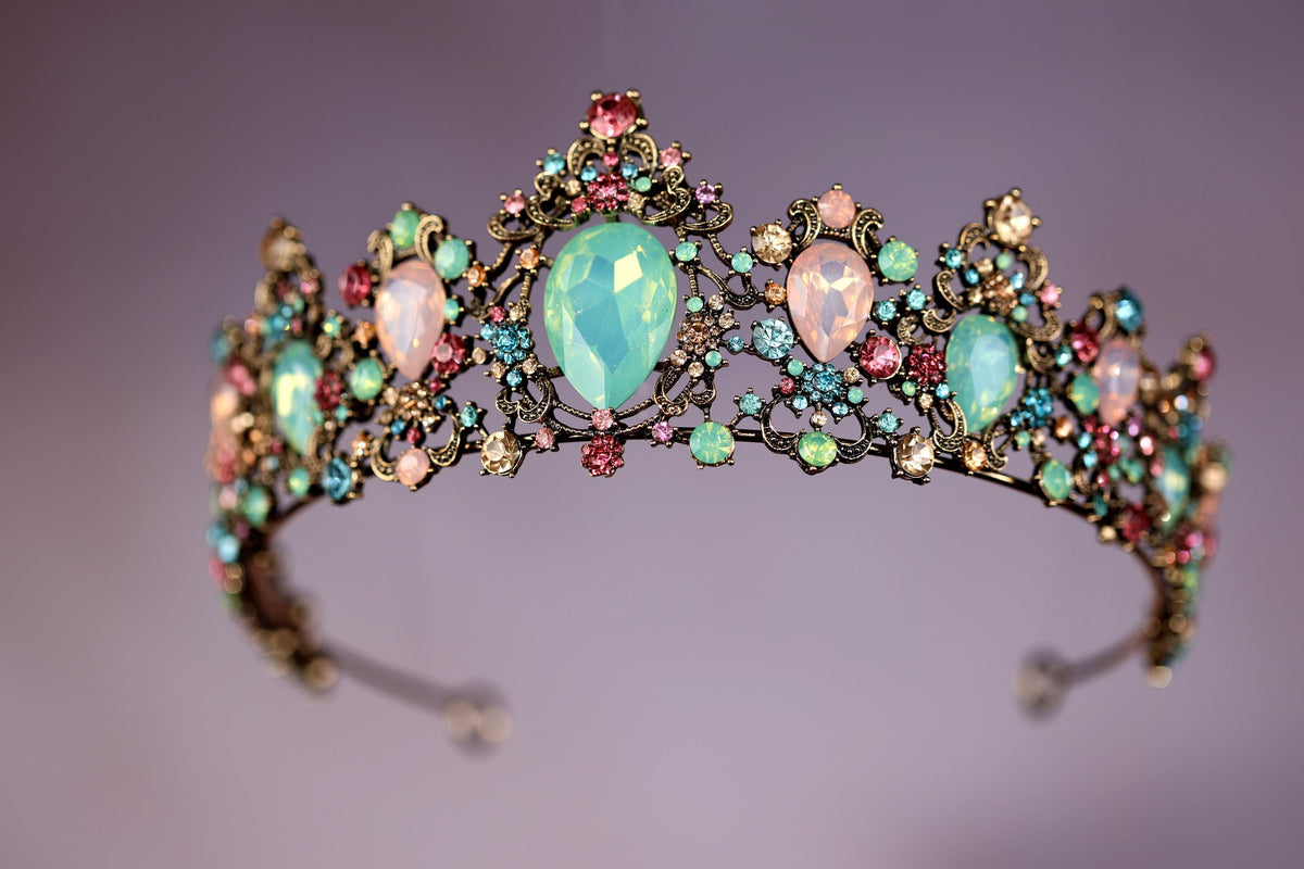 a tiara with opales and stones on it