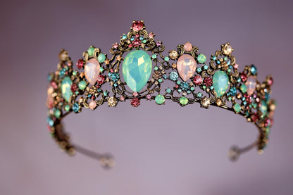 a tiara with opales and stones on it