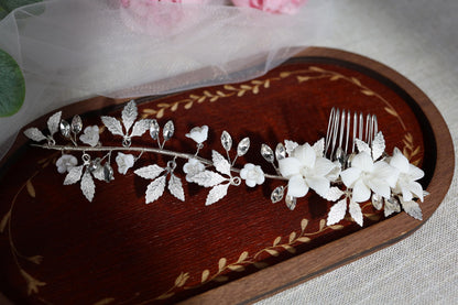 a close up of a piece of wood with flowers on it