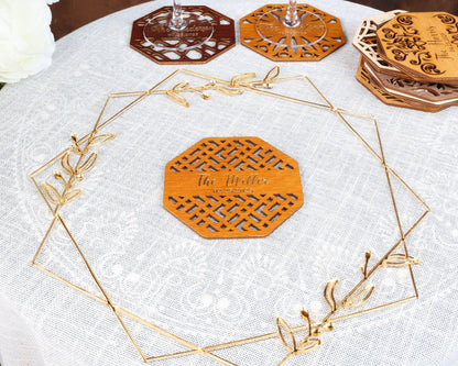 a table topped with a white table cloth covered in wooden coasters
