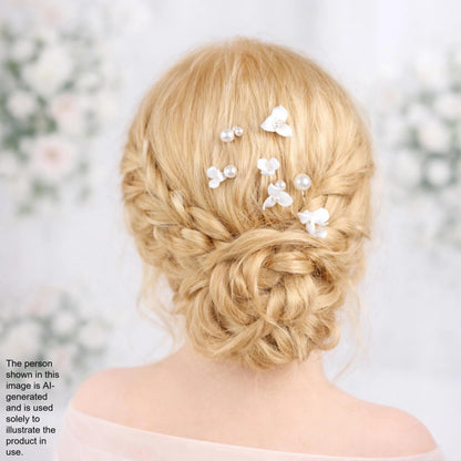 a woman's blonde hair styled in an intricate updo, adorned with small white flowers.