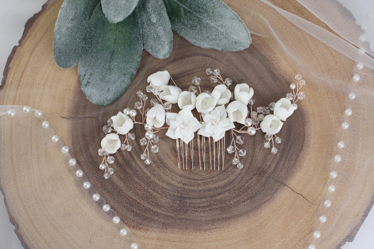 a close up of a hair comb with flowers on it