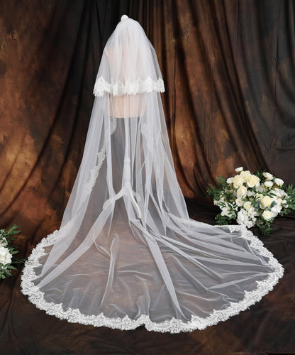 a white wedding veil with a lace edge