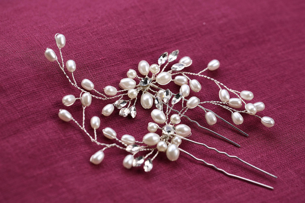 a close up of a hair comb with pearls