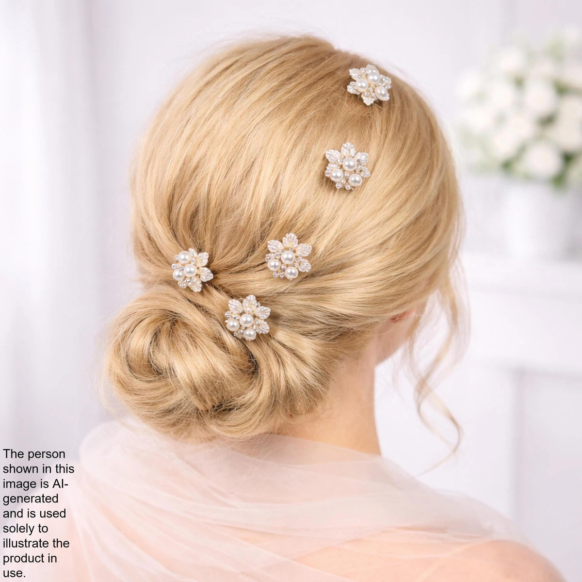 a woman's blonde hair styled in a bun, adorned with small, sparkling flower-shaped hair clips.
