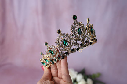 a woman holding a tiara in her hand