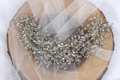 a bridal tiara on a piece of wood