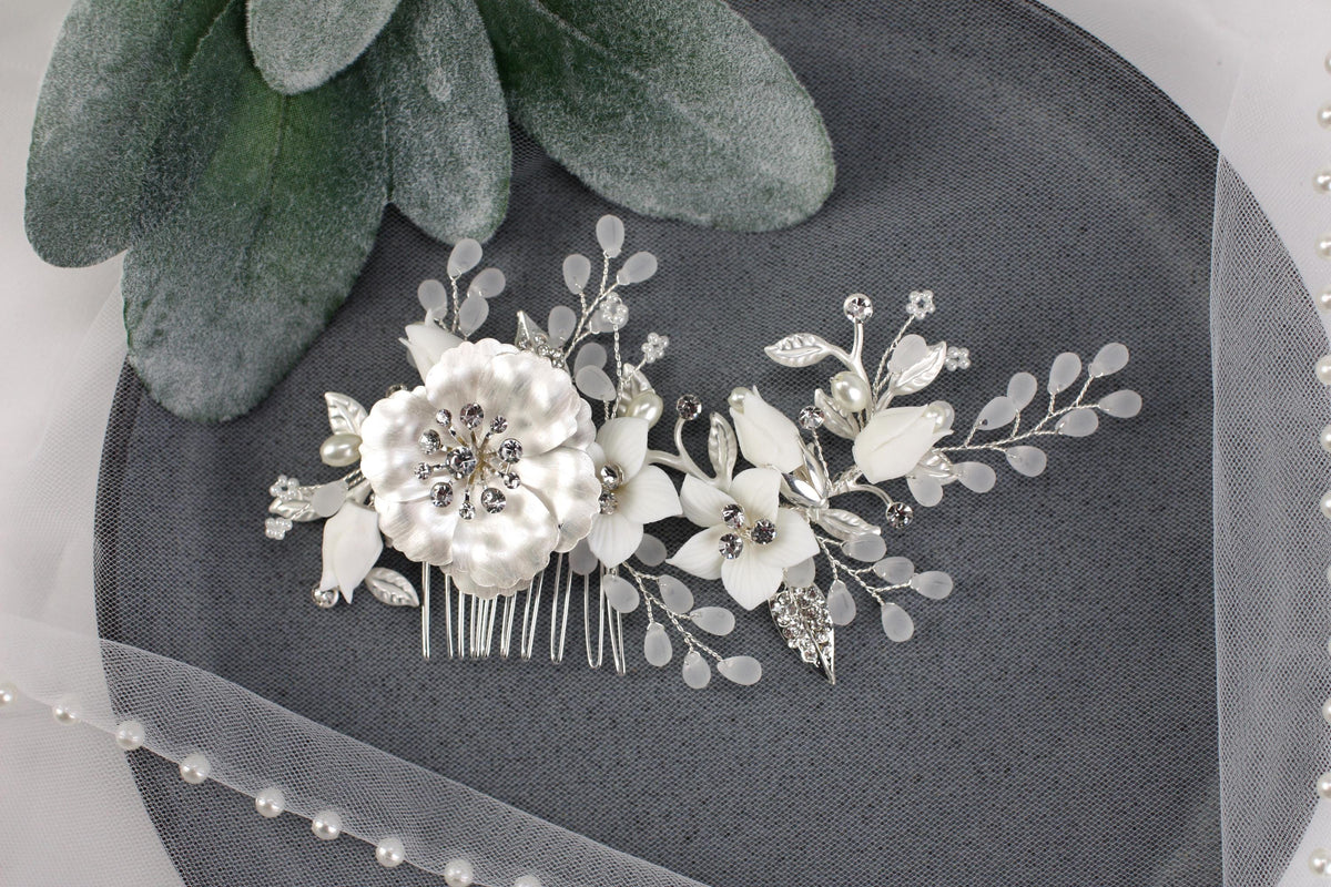a close up of a hair comb with flowers on it
