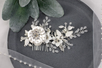 a close up of a hair comb with flowers on it