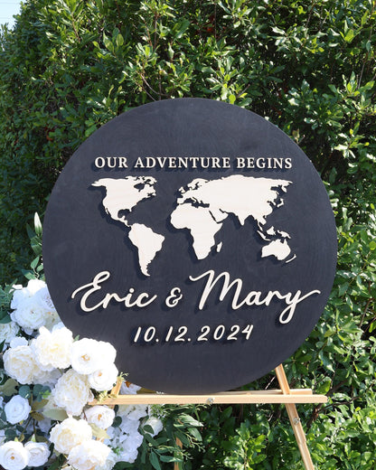 a black sign with a map of the world on it
