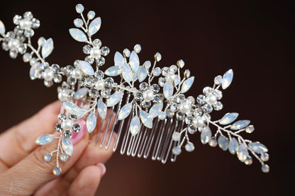 a close up of a person holding a hair comb